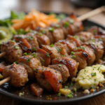 A plate of freshly grilled Adana Kebab, made with seasoned ground lamb, skewered and charred to perfection, served with sumac onions, grilled vegetables, and warm flatbread.